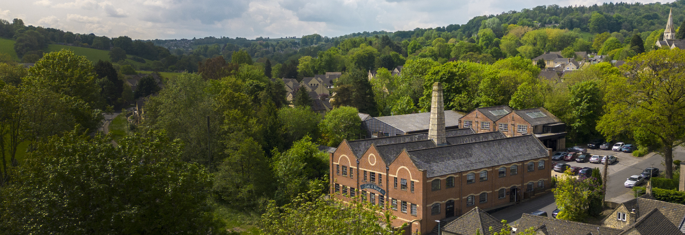 aerial shot of lewis and wood mill in cotswolds
